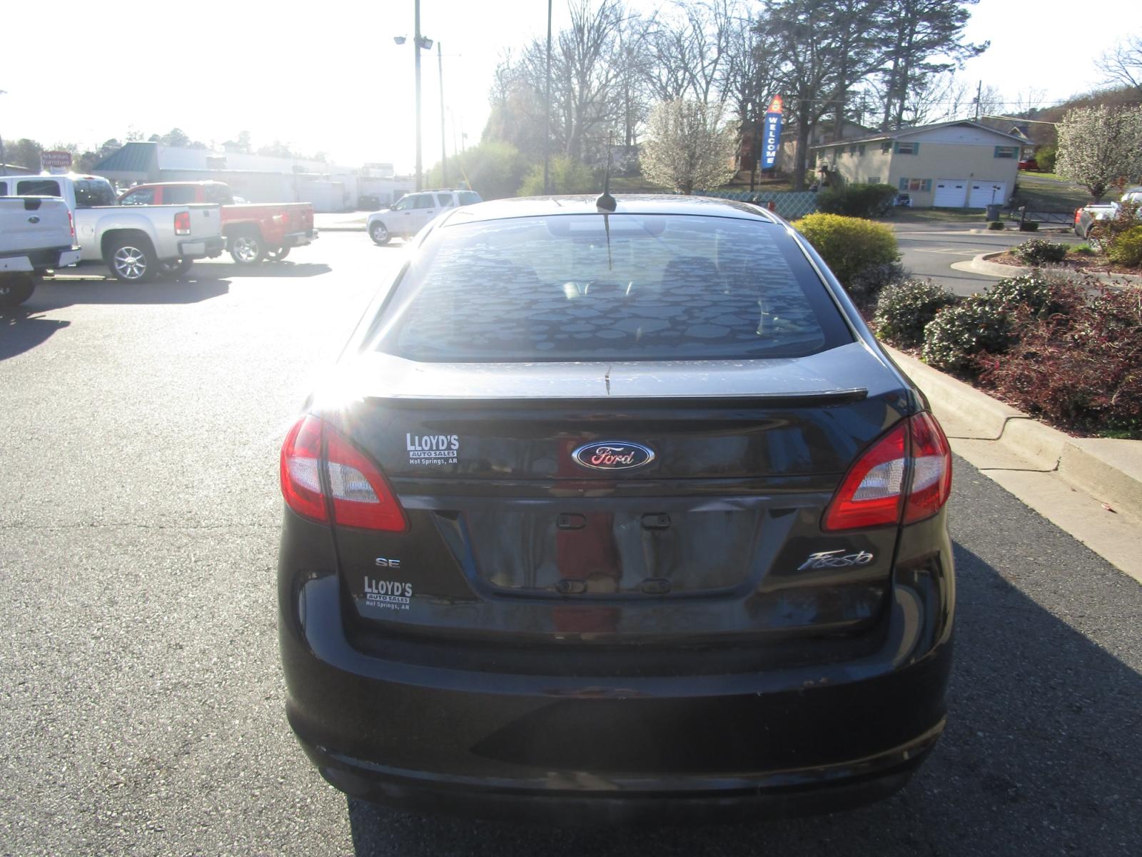 2013 BLACK /Black / Cloth Ford Fiesta SE Sedan (3FADP4BJ5DM) with an 1.6L L4 DOHC 16V engine, located at 1814 Albert Pike Road, Hot Springs, AR, 71913, (501) 623-1717, 34.494228, -93.094070 - Photo #3